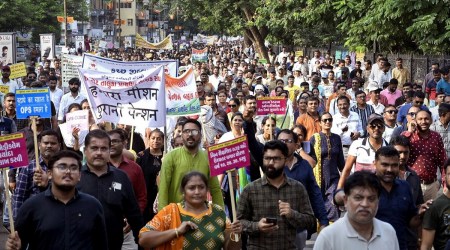 Government employees under the banners of Gujarat State Employees Mahamandal and Gujarat State United Employees Front participate in a protest march over various demands including restoration of the old pension scheme, in Rajkot, September 11, 2022. (PTI)