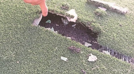 The damaged astroturf. (Express Photo)