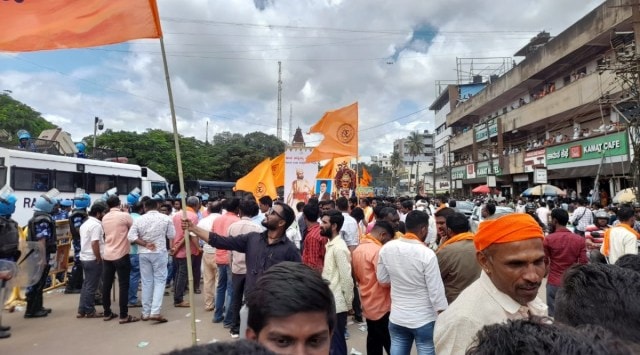 Right wing organisations displaying photos of Veer Savarkar and Shivaji during the Ganesha procession near Hubballi Idgah maidan. (Express photo)