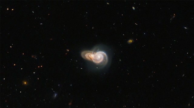 Hubble image shows two spiral galaxies seemingly overlapping