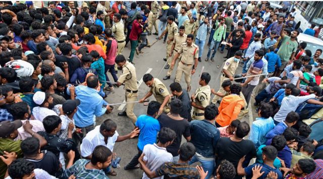 Police personnel baton charge on cricket fans gathered to buy tickets for India vs Australia T20 match, following a stampede at Gymkhana Ground in Hyderabad. (PTI)