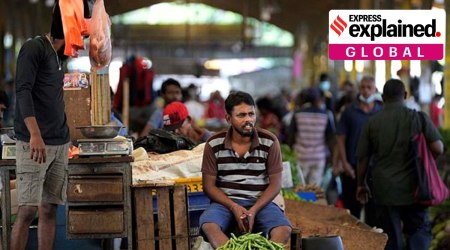 A vender waits for customers at a vegetable market place in Colombo, Sri Lanka, Friday, June 10, 2022. (AP Photo)