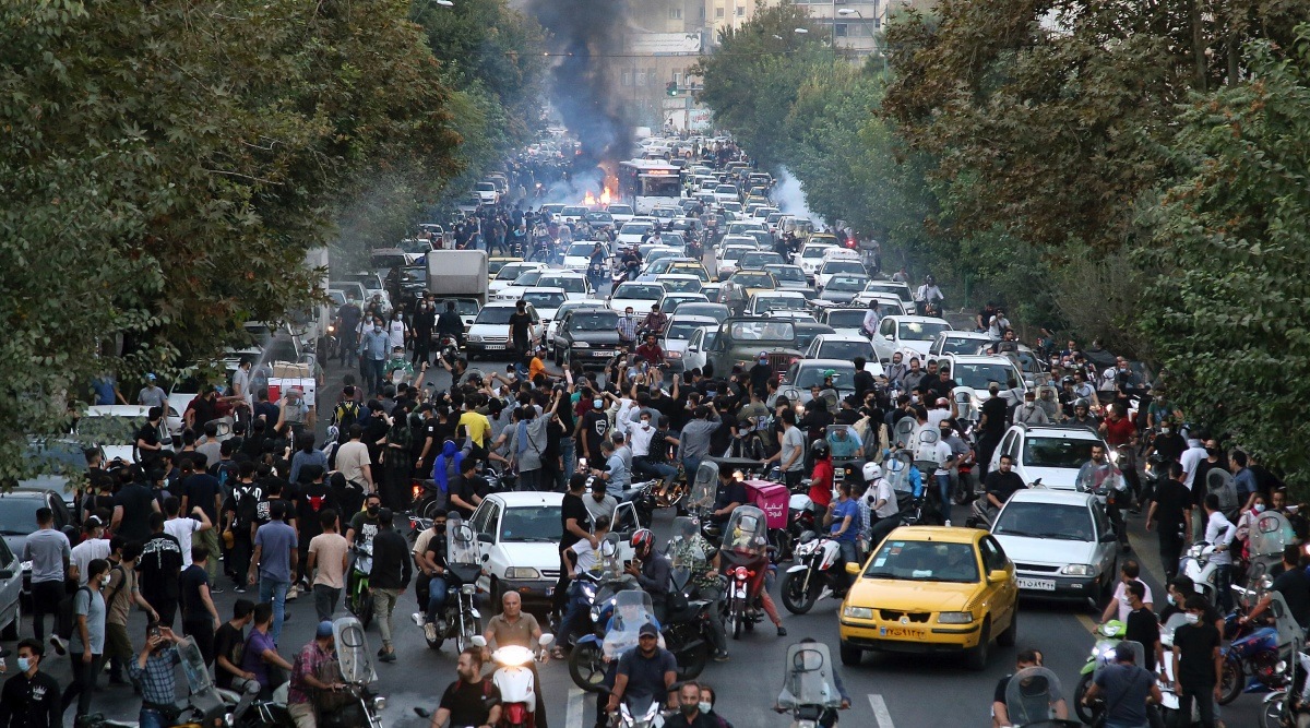 In this Wednesday, Sept. 21, 2022, photo taken by an individual not employed by the Associated Press and obtained by the AP outside Iran, protesters chant slogans during a protest over the death of a woman who was detained by the morality police, in downtown Tehran, Iran. (AP Photo)
