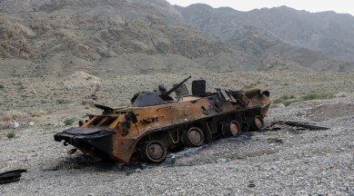 FILE PHOTO: A view shows a burnt armoured personnel carrier of Kyrgyz forces near Golovnoi water distribution facility outside the village of Kok-Tash in Batken province, Kyrgyzstan May 5, 2021. (REUTERS/FILE)