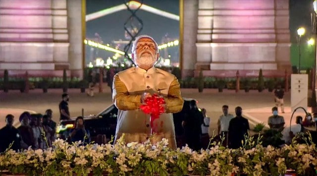 Prime Minister Narendra Modi pays tribute after inaugurating the statue of Netaji Subhas Chandra Bose as part of the revamped Central Vista, in New Delhi. (PTI)