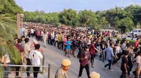 Students stage a protest over objectionable videos of several women students were allegedly recorded by a hosteller, at Chandigarh University in Mohali district, Sept. 18, 2022. (PTI)