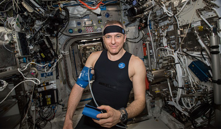 International space station astronaut wearing bio-monitor