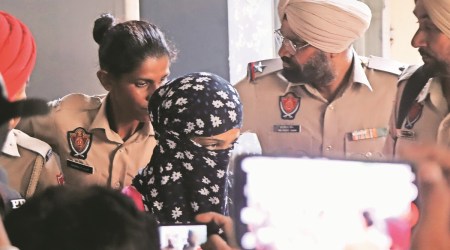 One of the three accused being produced in a court in Kharar, Punjab, on Monday. (Express photo by Jasbir Malhi)