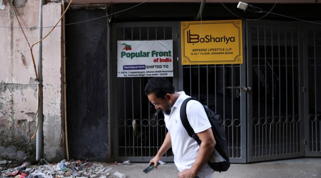 A man walks past the old office of Popular Front of India (PFI) Islamic group, in New Delhi, India, September 28, 2022. (REUTERS/Anushree Fadnavis)