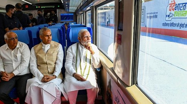 Prime Minister Narendra Modi with Gujarat Governor Acharya Devvrat and Gujarat CM Bhupendra Patel rides the Gandhinagar-Mumbai Vande Bharat Express train after flagging it off, in Gandhinagar, Friday, Sept. 30, 2022. (PTI Photo)