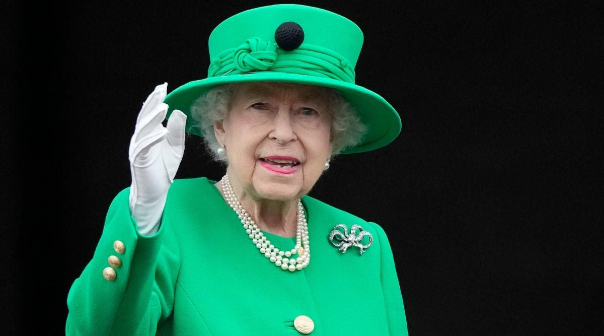 Queen Elizabeth II waves to the crowd during the Platinum Jubilee Pageant at the Buckingham Palace in London, Sunday, June 5, 2022. (AP Photo/Frank Augstein, File)