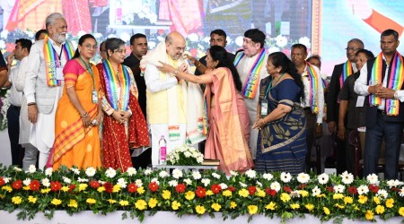 Union Cooperation Minister Amit Shah during a joint annual general meeting of seven district-level cooperative bodies in Amreli on Sunday. (Express photo)
