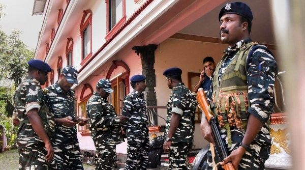 Security personnel stand guard outside the RSS office in Kochi on Wednesday. PTI