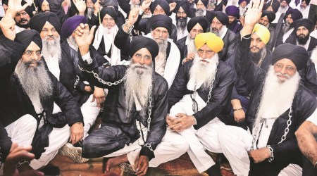 SGPC president Harjinder Singh Dhami and others protest for demanding release of Sikh prisoners, in Amritsar on Monday.  (Express Photo by Rana Simranjit Singh)