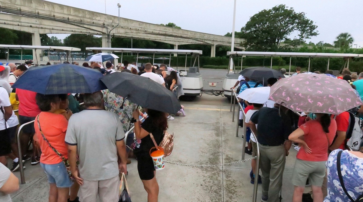 Guests wait for tram transportation at the Magic Kingdom at Walt Disney World after the park closed early to accommodate an evening special event, Sept 27, 2022, in Lake Buena Vista, Florida. (AP)
