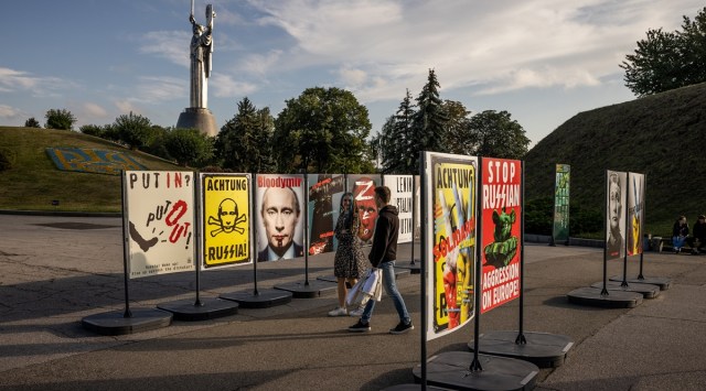 Signs against Russian President Vladimir Putin are seen in Kyiv, Ukraine, on Sunday, Sept. 11, 2022. (Jim Huylebroek/The New York Times)