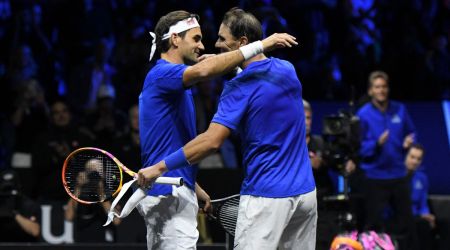 Roger Federer hugs Rafael Nadal
