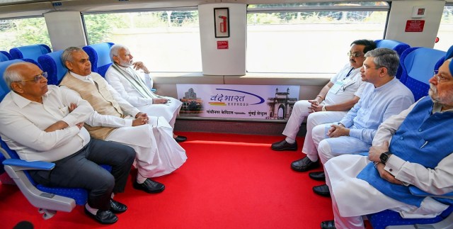 Gandhinagar: Prime Minister Narendra Modi with Railways Minister Ashwini Vaishnaw, Union Minister for Petroleum & Natural Gas Hardeep Singh Puri, Gujarat Governor Acharya Devvrat, Gujarat CM Bhupendra Patel and Gujarat BJP President C.R. Patil rides the Gandhinagar-Mumbai Vande Bharat Express train after flagging it off, in Gandhinagar, Friday, Sept. 30, 2022. (PTI Photo)