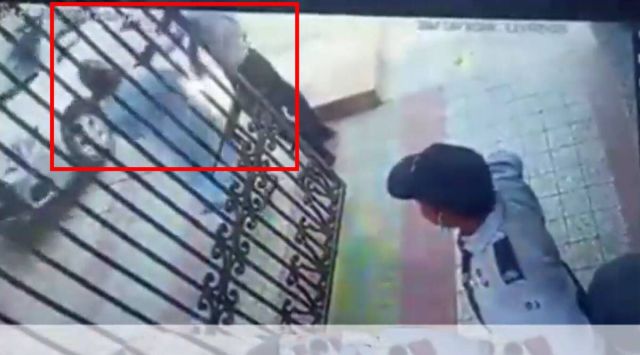 In the CCTV footage, the woman is seen walking towards a group of three security guards and slapping one of them. (Screengrab) 