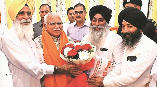 Members of Haryana Gurudwara bodies with Chief Minister Khattar at his residence in Chandigarh on Friday. (Express)