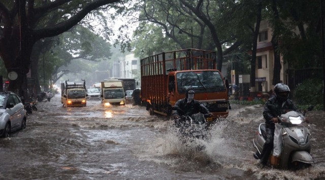 Water logging on Jangli Maharaj Road due to heavy rainfall on Friday. (Express photo by Oshwin Kadhao)