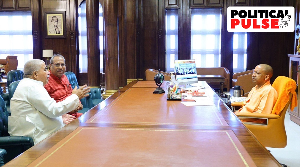 After the High Court's decision, NISHAD party chief Sanjay Nishad (Left, in red attire) and his BJP colleague in the state Cabinet, Rakesh Sachan, met Chief Minister Yogi Adityanath seeking inclusion of the 17 OBC sub-castes in the SC list. (Photo: twitter/@Rakesh_Sachan_)