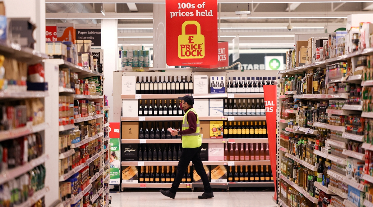 A employee walks inside a Sainsbury's supermarket in Richmond, west London, Britain (REUTERS/File photo)