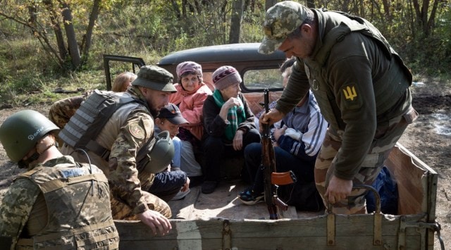 Ukrainian soldiers help civilians flee villages around the city of Lyman, in eastern Ukraine, on Thursday, Sept. 22, 2022. The battle for the critical Donbas region in Ukraine is centered on two strategically important cities: Lyman, held by the Russians, and Bakhmut, held by Ukraine. (Tyler Hicks/The New York Times)