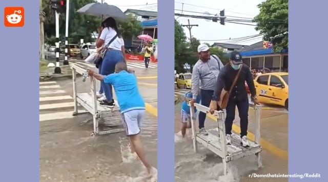 Clever idea cross flooded road, man helps people cross flooded road on pushcart, viral video columbia people crossing road on pushcart, innovative idea to cross flooded road, flooded streets crossing, Indian express