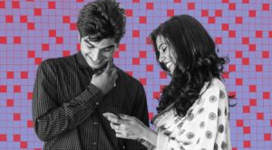 two young indian gen z people look at phone with a purple and red crossword background behind them