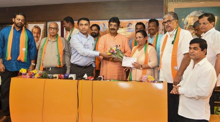 Goa Chief Minister Pramod Sawant and Goa BJP President Sadanand Shet Tanavade welcome eight Congress MLAs who joined the party, in Panaji, Wednesday, Sept. 14, 2022.(PTI Photo)