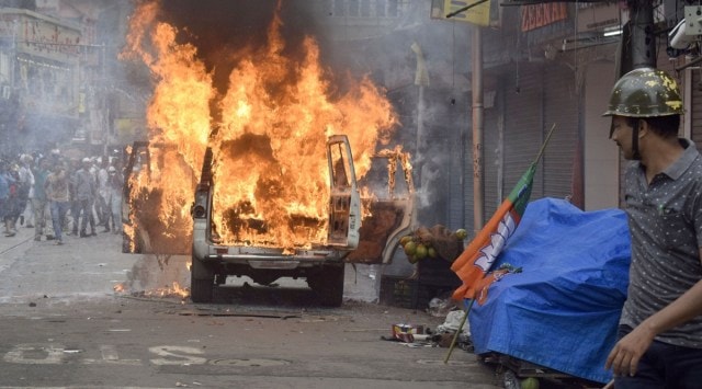 Police vehicle burns on MG Road in Kolkata. (Express photo)