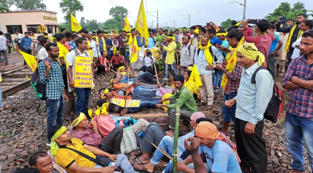 Agitators from the Kurmi community block railway tracks to press for their demand for Scheduled Tribe (ST) status, in West Medinipur district. (PTI Photo)