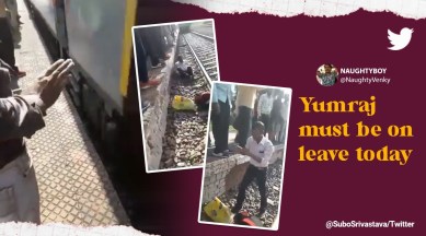Man survives after falling near running train, viral video man survives after falling on railway track, man left unharmed after falling near running train, Bharthana railway station, Indian express