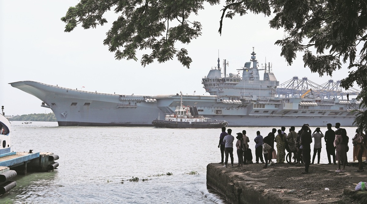 People catch a glimpse 
of INS Vikrant, in Kochi 
on Friday. (AP Photo)