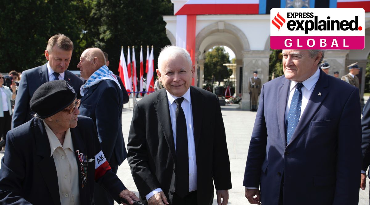 Poland's main ruling party leader Jaroslaw Kaczynski, center, attends a wreath laying ceremony marking national observances of the anniversary of World War II in Warsaw, Poland, Sept. 1, 2022. (AP Photo/Michal Dyjuk)