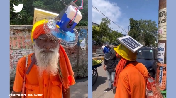 Lakhimpur Kheri, Sadhu wears portable fan on head, 77 year old creates solar powered portable fan, 77 year old UP man makes wearable fan, UP man invents wearable solar fan, solar fan viral jugaad video, Indian express