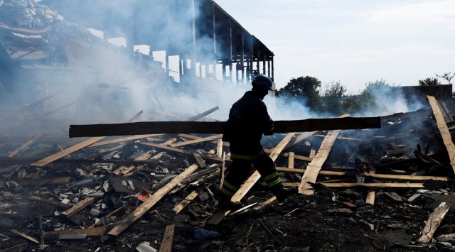 File photo of a Ukrainian firefighter removing rubble in a factory destroyed by a Russian strike in the city of Slovyansk, in war-affected area in eastern Ukraine. (Reuters)