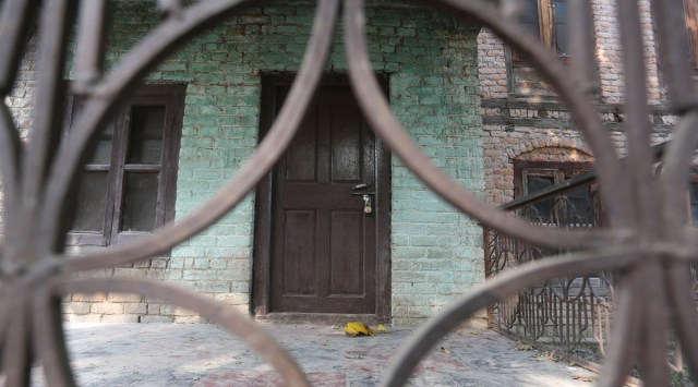 A locked home of a Kashmiri Pandit family in Chowdhary Gund village of south Kashmir’s Shopian district. (Express photo by Shuaib Masoodi)