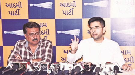 AAP’s Rajya Sabha MP Raghav Chadha addresses a press conference in Rajkot Monday. (Express Photo)