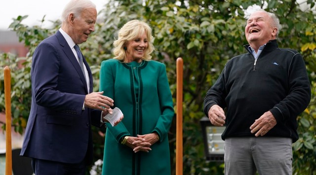 Dale Haney, the chief White House groundskeeper, right, laughs as he stands with President Joe Biden and first lady Jill Biden during a tree planting ceremony on the South Lawn of the White House (AP Photo/Evan Vucci)