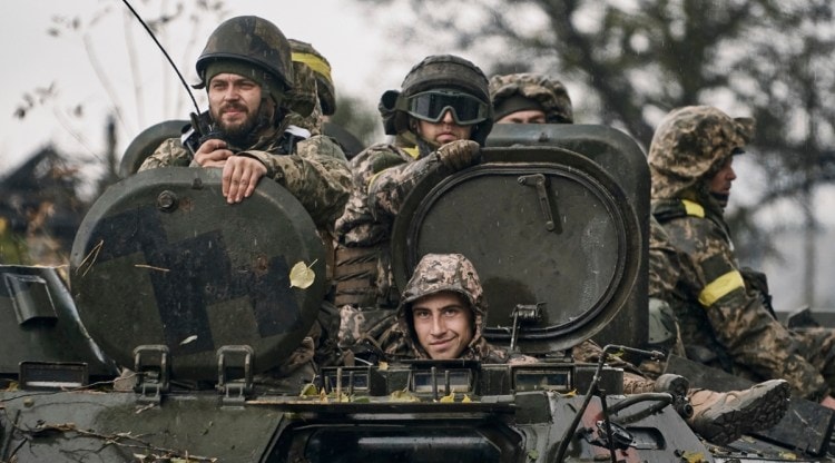 Ukrainian soldiers ride an APC in Donetsk region, Ukraine, Oct. 20, 2022. (AP)