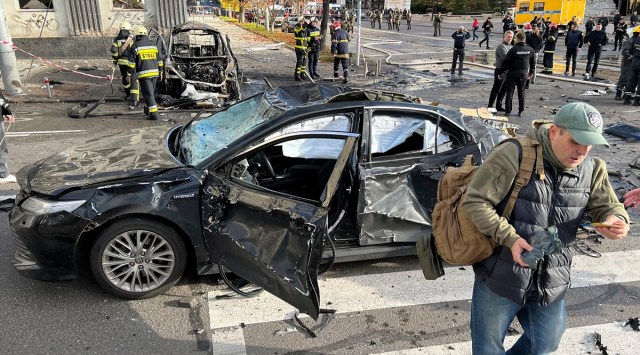 Rescue workers survey the scene of a Russian attack on Kyiv, Ukraine on Monday (AP photo)