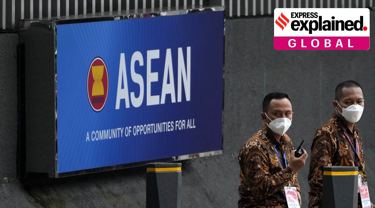 Security guards monitor their radio outside the Association of Southeast Asian Nations (ASEAN) Secretariat in Jakarta, Indonesia, Thursday, Oct. 27, 2022. (AP Photo/Achmad Ibrahim)