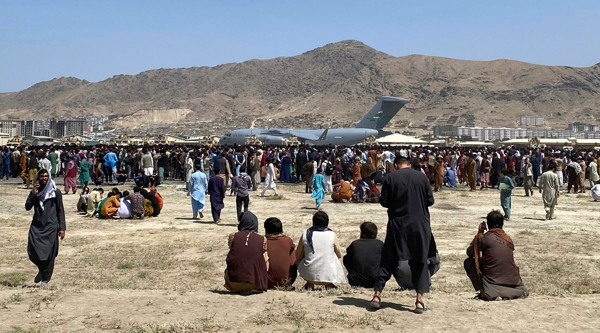 Hundreds of people gather near a US Air Force C-17 transport plane at the perimeter of the international airport in Kabul, Afghanistan, Aug. 16, 2021. (AP/file)