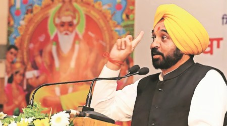 Chief Minister Bhagwant Mann addresses a gathering during  state level function to mark Vishwakarma Day, at  Ramgarhia College in Ludhiana on Tuesday. (Express Photo by Gurmeet Singh)
