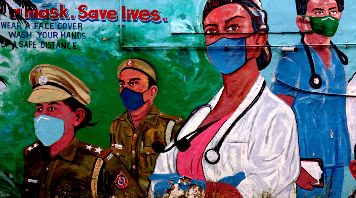 FILE-Wall painting to give message wear a mask and save lives to protect from COVID. (Express photo by Amit Mehra)