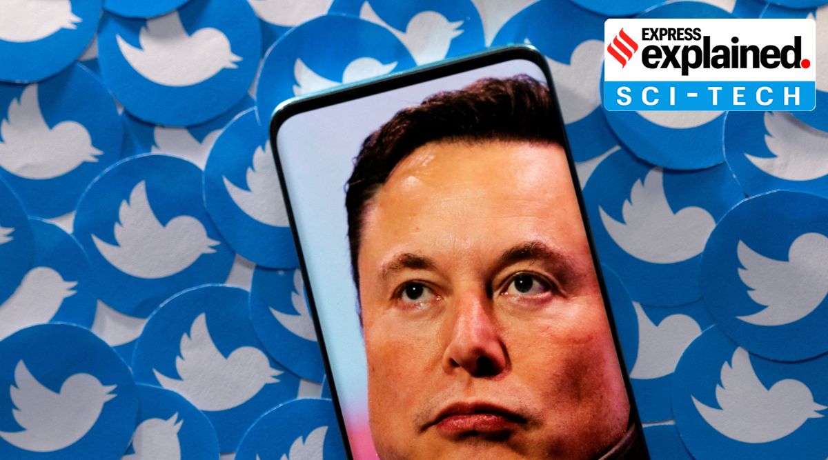 An image of Elon Musk is seen on a smartphone placed on printed Twitter logos in this picture illustration taken April 28, 2022. (Reuters: Dado Ruvic)