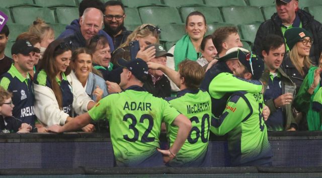 Ireland players celebrate with fans following their T20 World Cup cricket match against England through DLS. (AP)