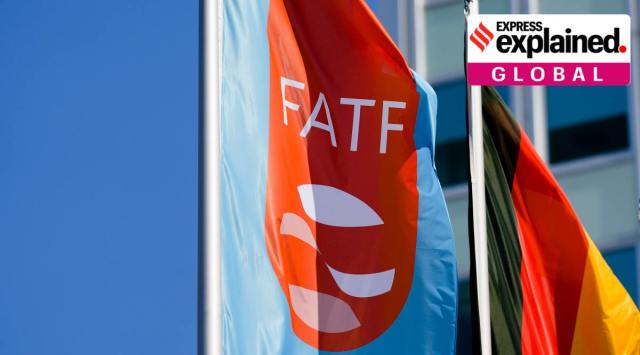 A flag with the logo of the Financial Action Task Force, FATF, waves in the wind next to the German national flag during a meeting of the task force at the Congress Center in Berlin, Germany, Friday, June 17, 2022. (AP Photo/Markus Schreiber, File)